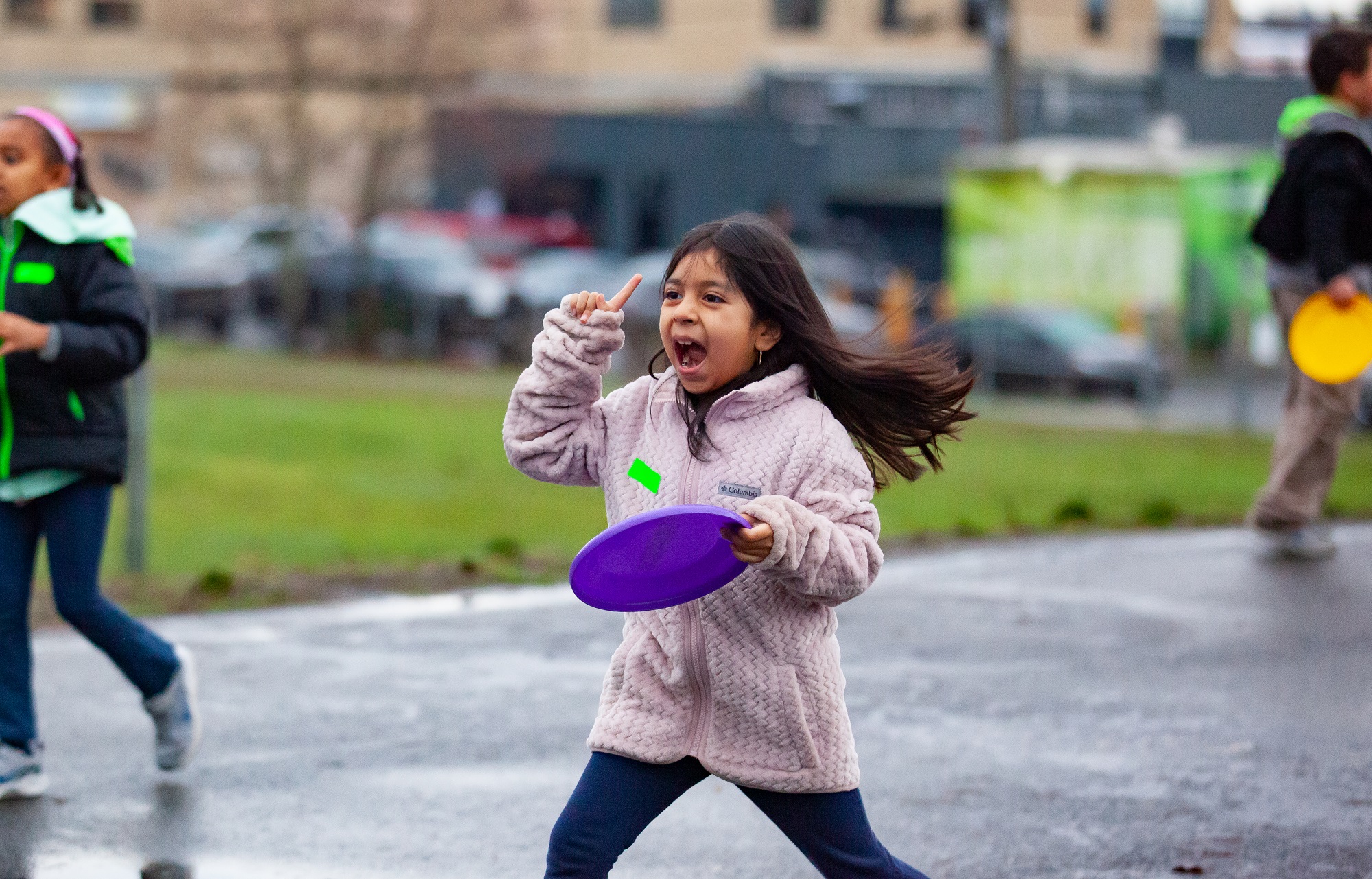 Student plays with frisbee at recess