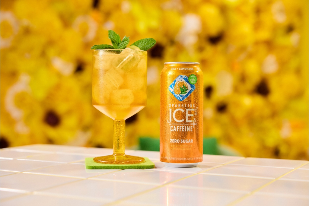 Sparkling Ice Sweet Tea and Vodka Lemonade cocktail on tile countertop with a yellow sunflower background.